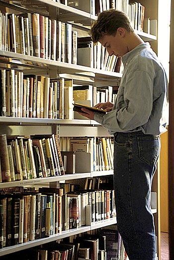 student in library