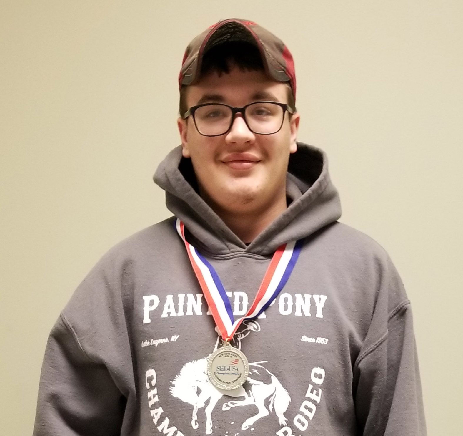 Headshot of Dakota wearing a medal.