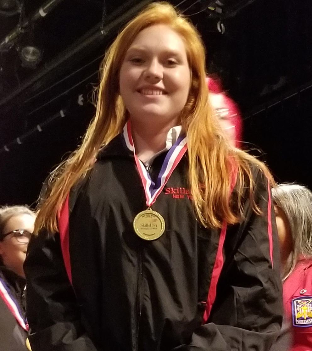 Meaghan smiles while wearing her first place medal.