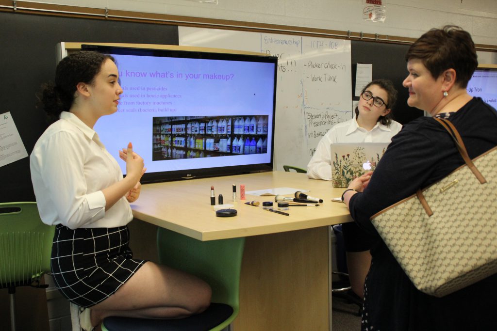 A student speaks to a business professional about her business concept