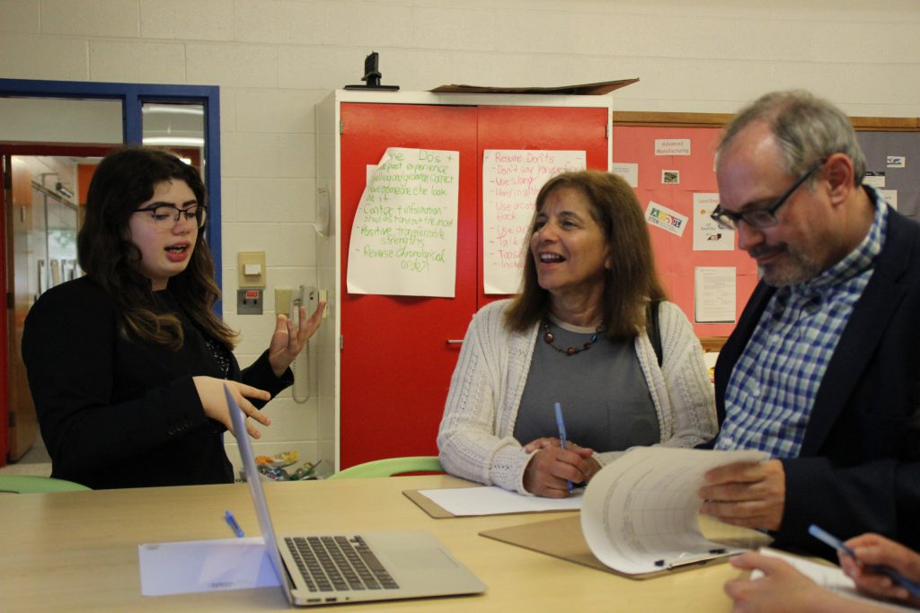 A student speaks to a business professional about her business concept