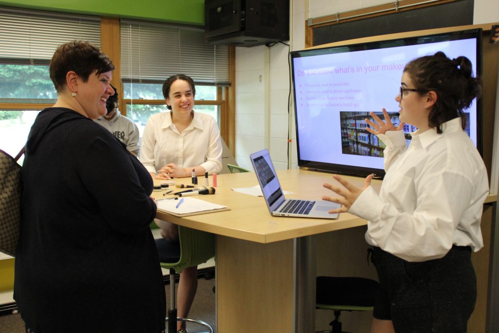 A student speaks to a business professional about her business concept.