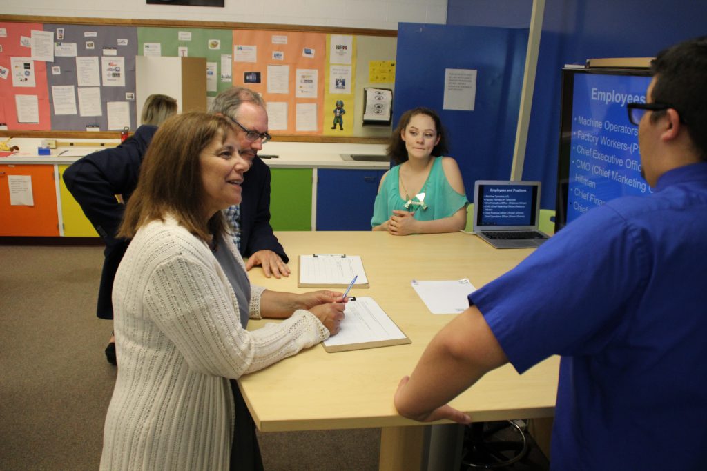 A student speaks to a business professional about his business concept