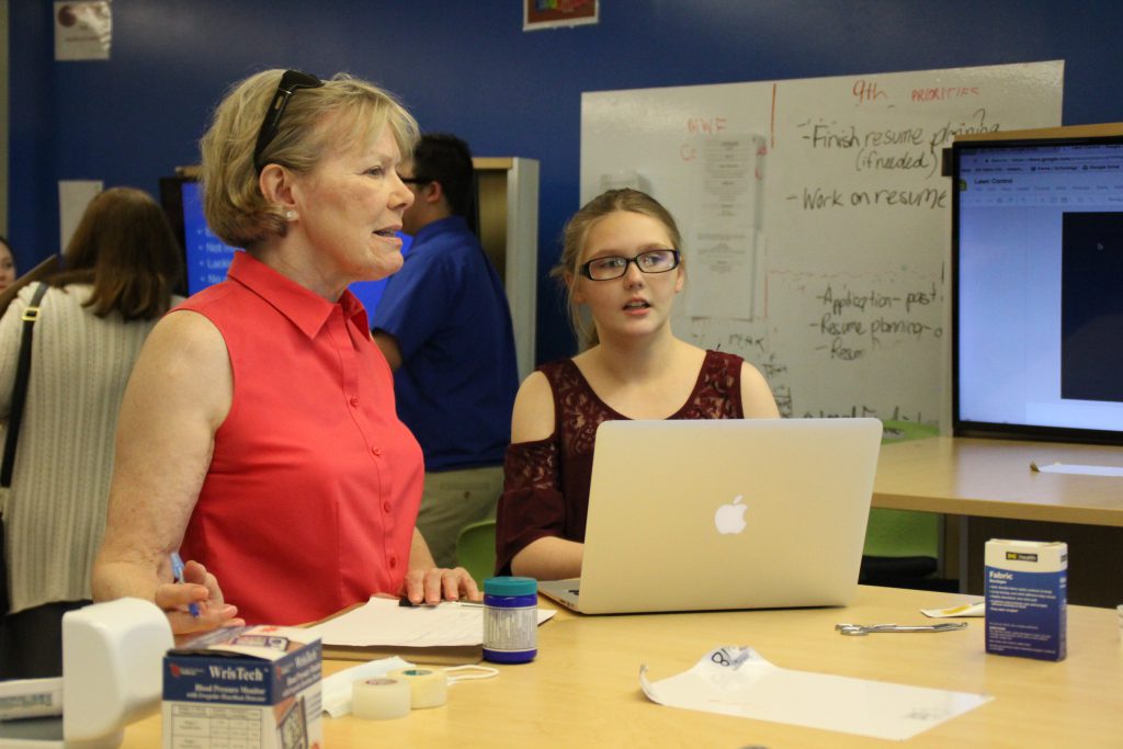 A student speaks to a business professional about her business concept