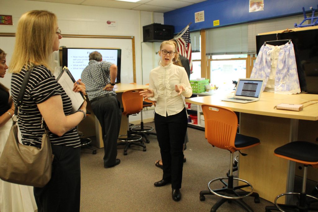 A student speaks to a business professional about her business concept