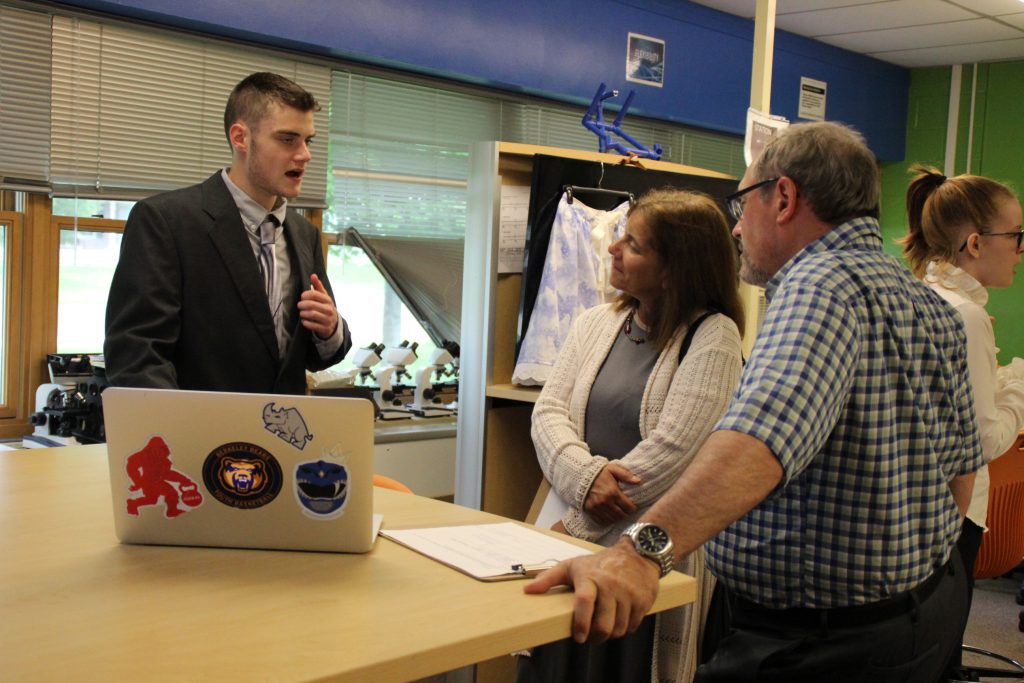 A student speaks to a business professional about his business concept