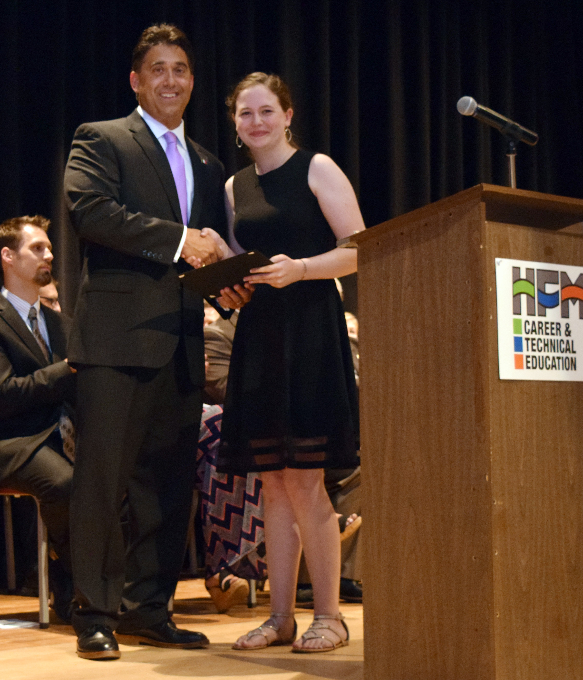 Anna King shakes hands with Mr. DeTraglia.
