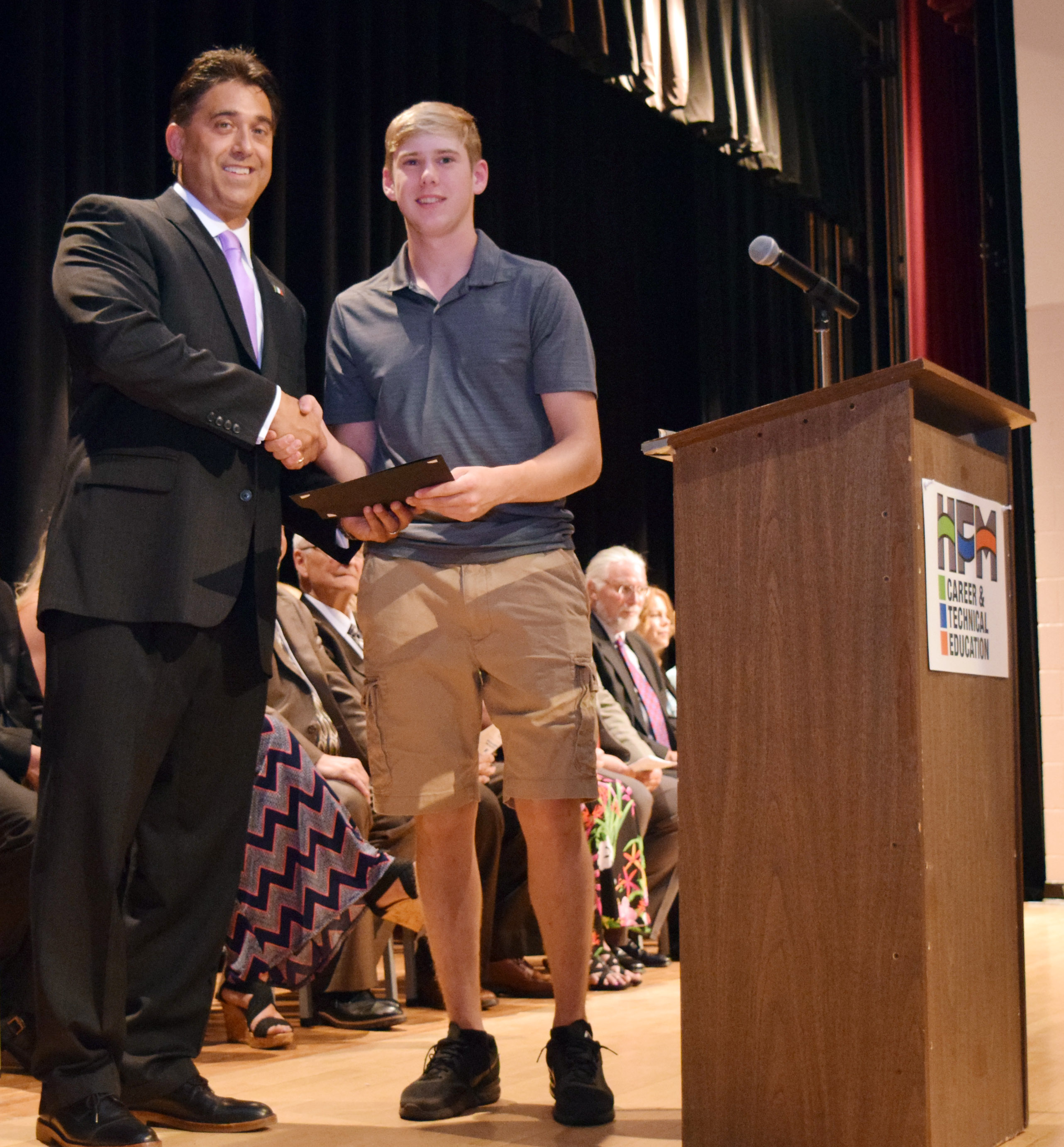 Mr. DeTraglia shakes hands with Jacob Albertine.