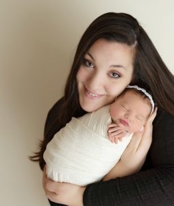 Cassandra Hehl holding a tiny infant