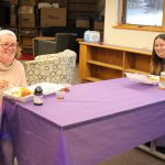 Students sitting at table with breakfast