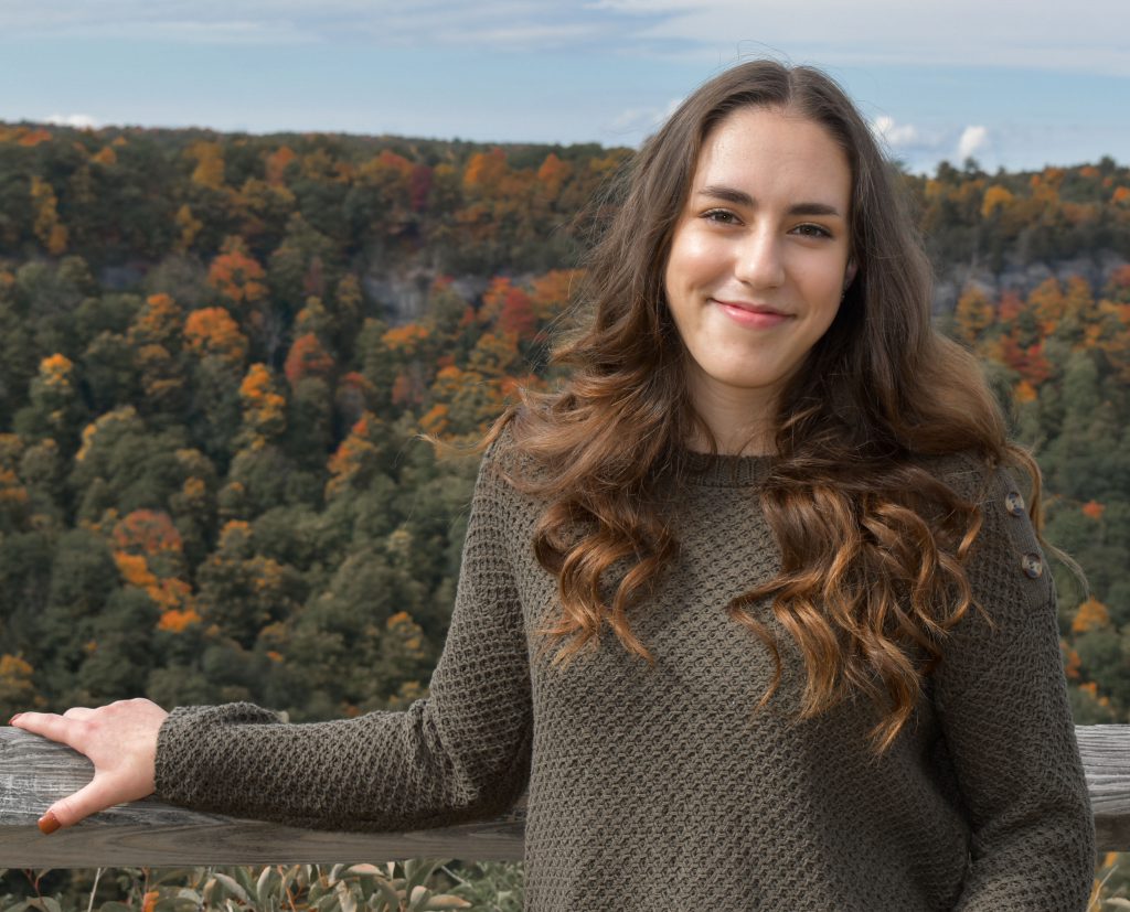 Molly Hotaling's senior portrait with a early fall tree scene in background