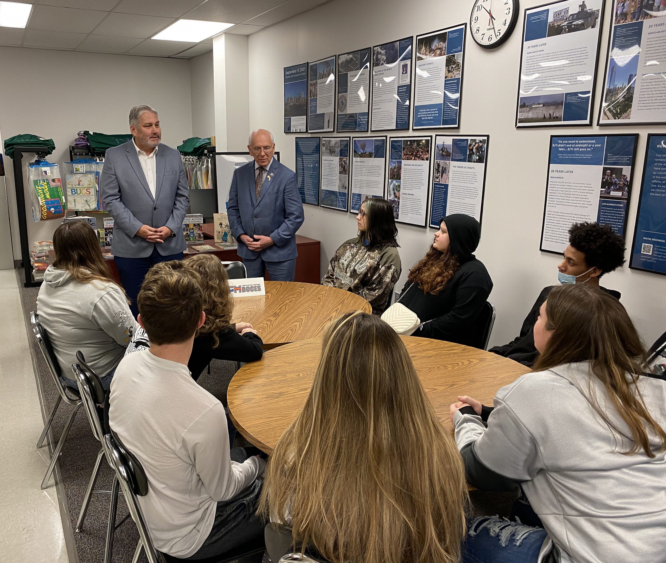 Tonko and Dave Ziskin speak with students seated at two round tables