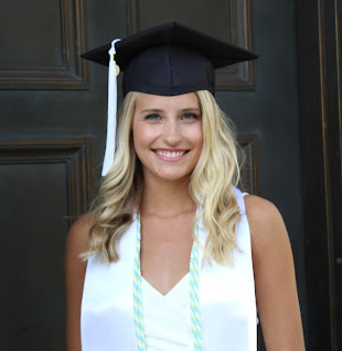 headshot of Reily wearing a mortar board and tassle