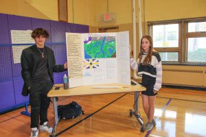 male and female student participate in the civilizations expo.