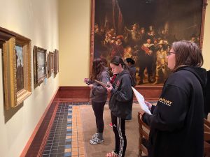 Students view artwork inside a gallery at the Arkell Museum in Canajoharie, NY.