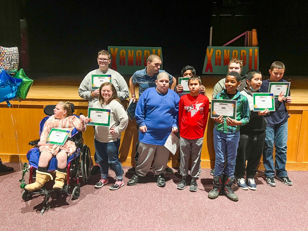 Students in Special Education classes at Gloversville Middle School were recently recognized for being named Students of the Month. The group photo includes 11 students posing with certificates of achievement. They were nominated for exhibiting character traits such as kindness, responsibility, hardworking, and encouraging.