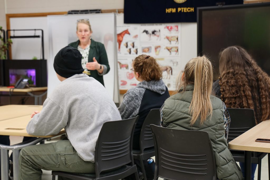 Students listen intently as Gretchen Subik of Hilltop Acres Farm speaks.