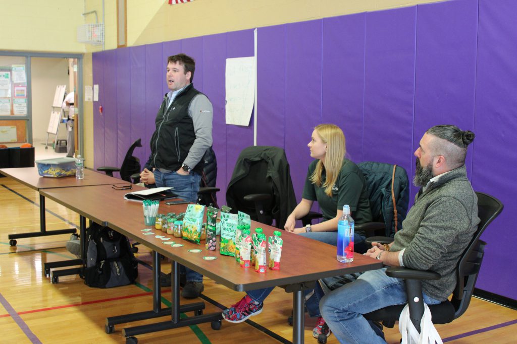 Todd Vincent of Taylor Made Products/Lippert speaks to students during a panel discussion. Seated is Brittany Duncan and Jim Oliver from Beech-Nut.