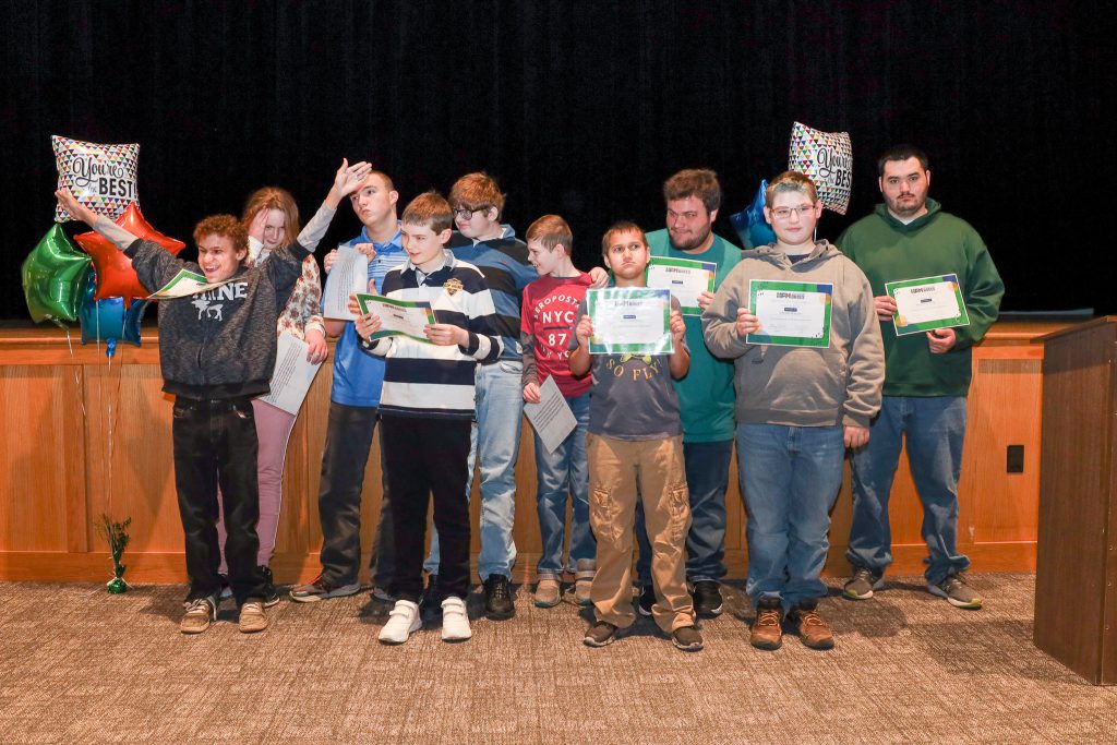 A group of students from the Special Education classes at Gloversville Middle School pose for a picture during a Student of the Month assembly.