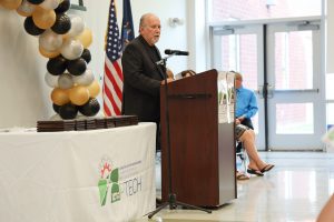 HFM BOCES Board of Education Harry Brooks addresses the crowd during the 6th annual HFM PTECH Completion Ceremony