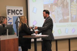 Gloversville Middle School Principal Andrew Jablonski is presented with the HFM School Library System Administrator of the Year Award. Presenting the award is Gloversvill Middle School Library Media Specialist Bobbie Lindsay.