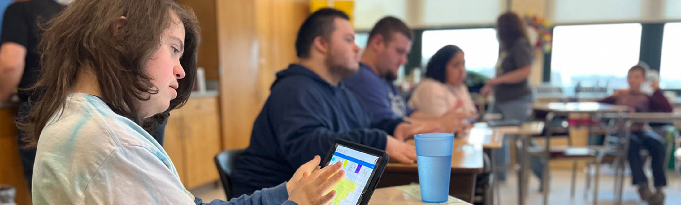 students sitting at desks working on assignment
