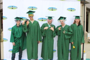 A group of Adirondack Academy students pose for a photo at the completion ceremony.