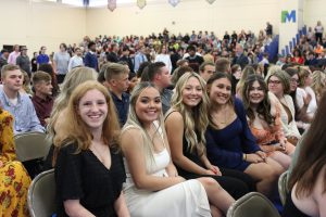 Cosmetology students pose for a picture while waiting for the CTE commencement ceremony to start