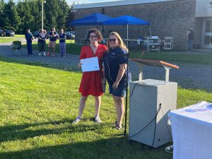 two people pose with certificate