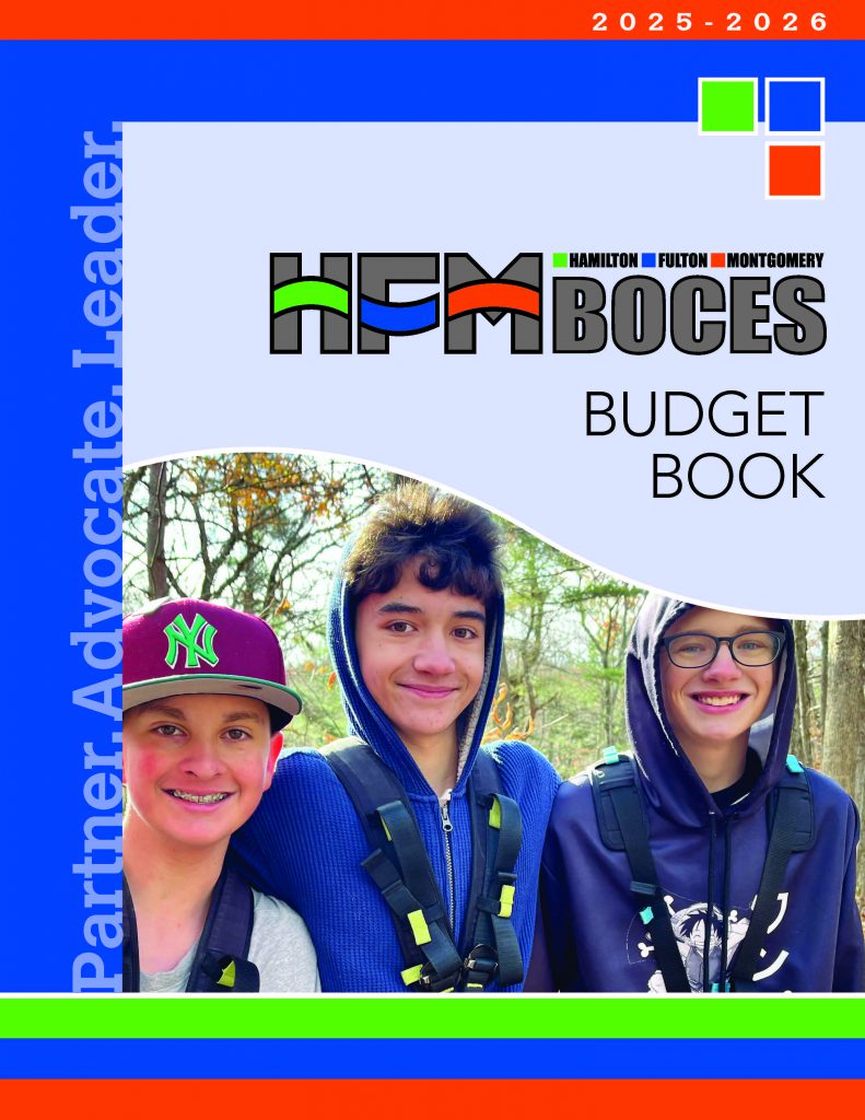 Front cover of the 2025-26 HFM BOCES Budget Book features three PTECH students posing for the camera and all have smiles on their faces. The students are on a field trip at a high ropes course outdoors