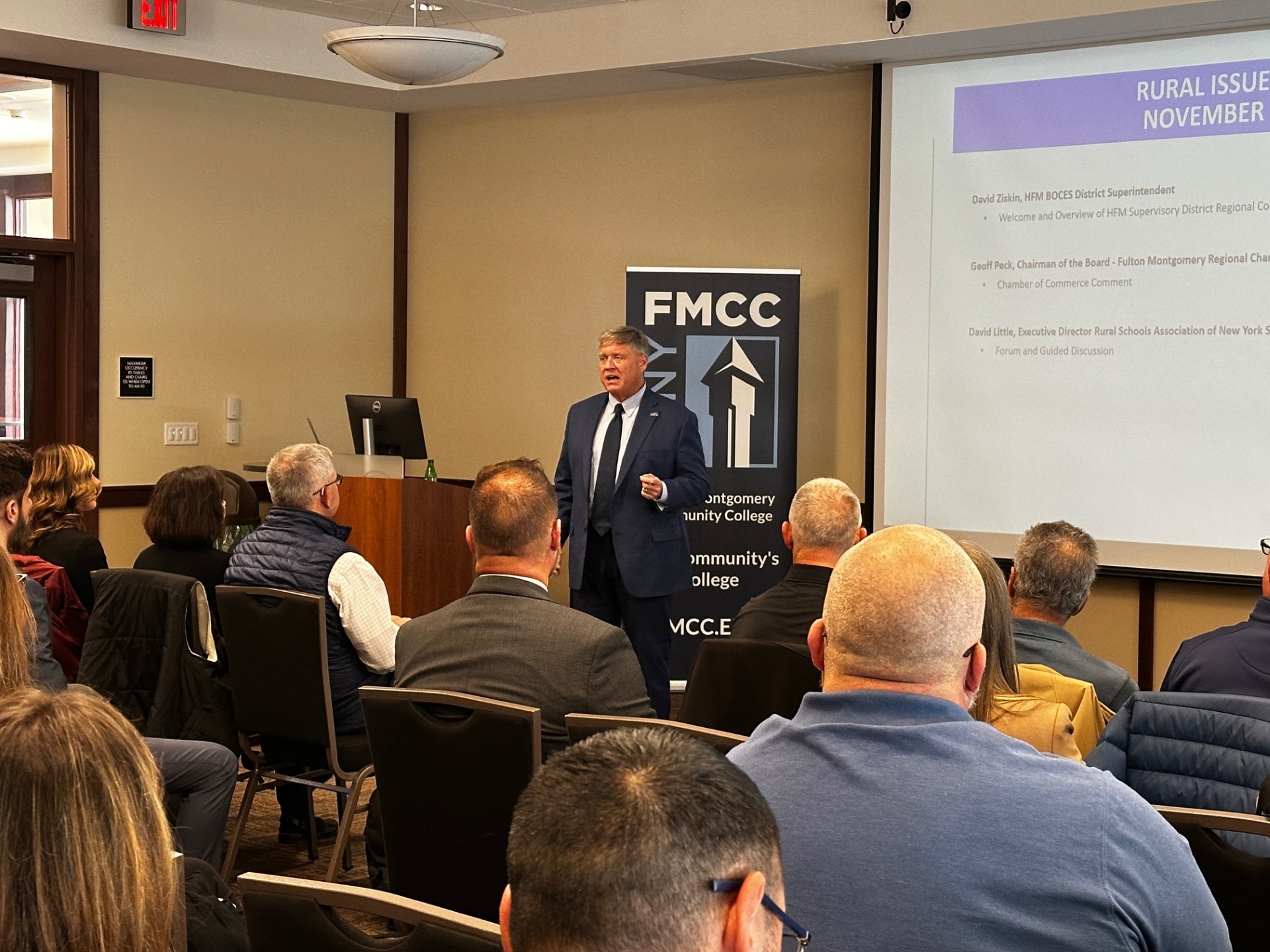 David Little is standing in the front of the room as he speaks to a room full of regional leaders on Wednesday, Nov. 12 at the Rural Schools Issues Forum held at SUNY Fulton-Montgomery Community College.