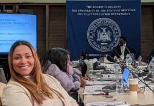 Noraima Rivera Rivas poses for a picture before speaking to the New York State Board of Regents.