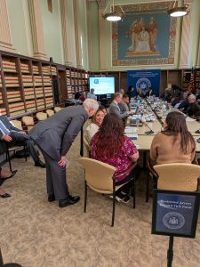 Noraima Rivera Rivas speak with Board of Regents member Roger Catania.